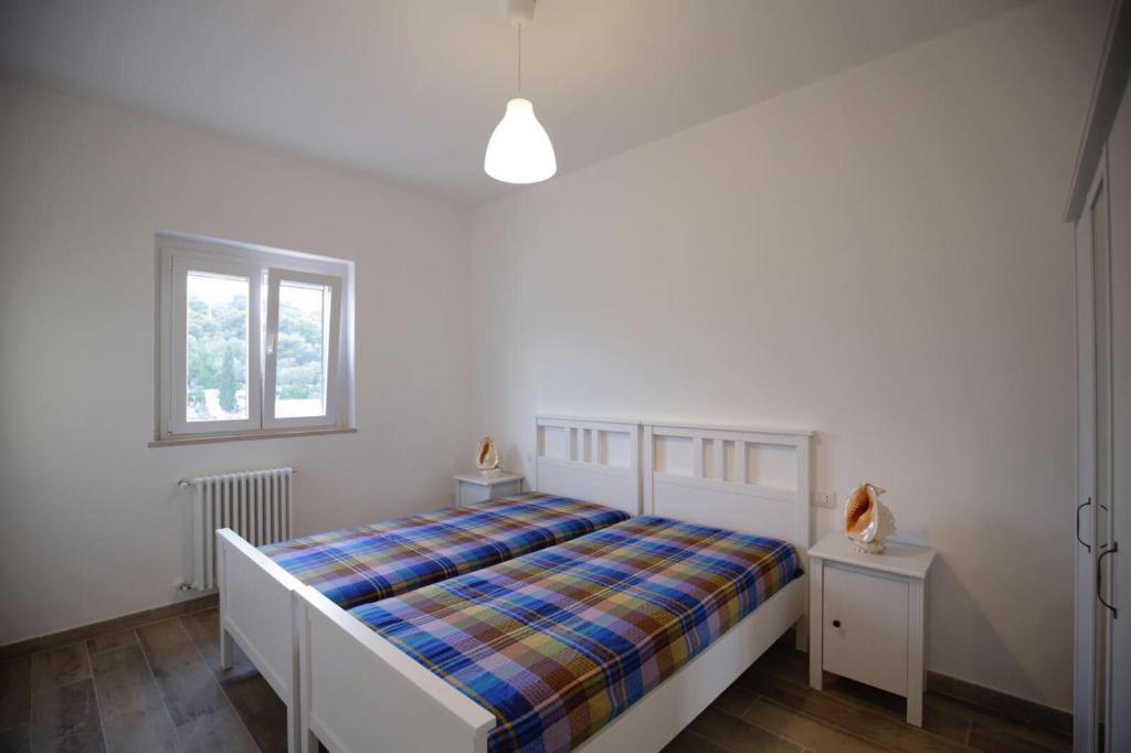 A bed or beds in a room at La Conchiglia appartamento Vieste mare