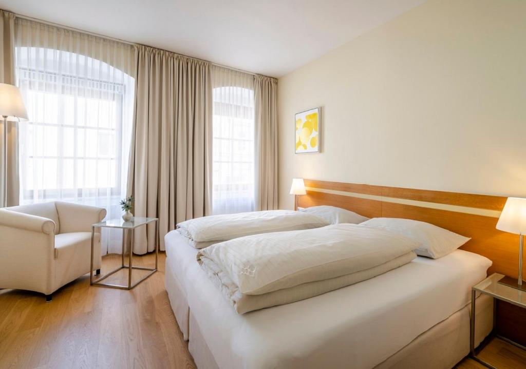 Postel nebo postele na pokoji v ubytování Boutique Hotel Hauser