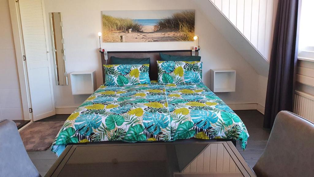 Ein Bett oder Betten in einem Zimmer der Unterkunft Guesthouse Zandvoort
