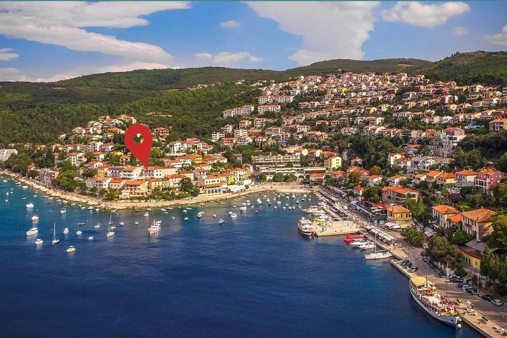 an aerial view of a town with boats in the water at zdenka in Rabac