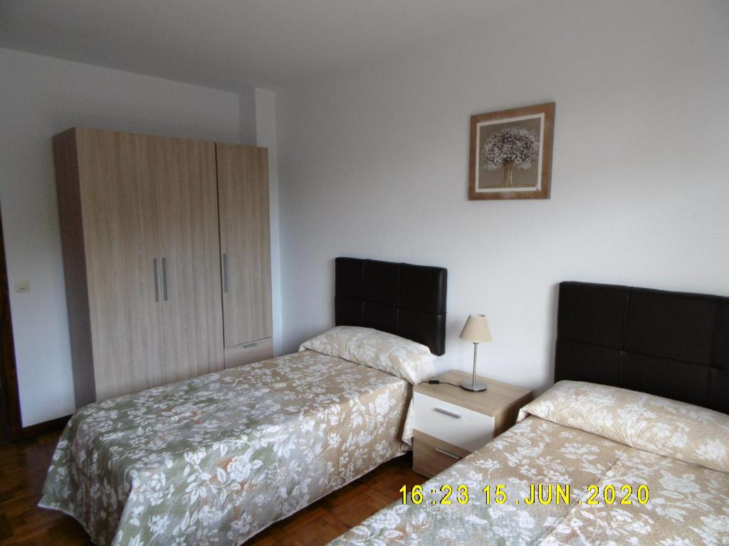 A bed or beds in a room at Apartamento Anjana