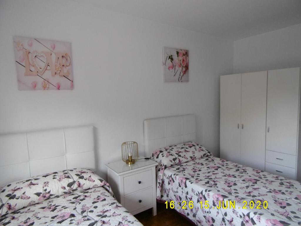 A bed or beds in a room at Apartamento Anjana