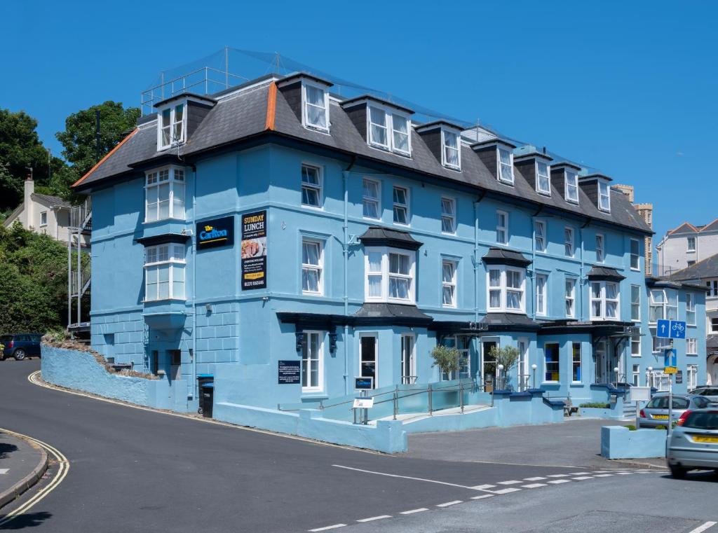 a blue building on the corner of a street at Carlton Hotel in Ilfracombe