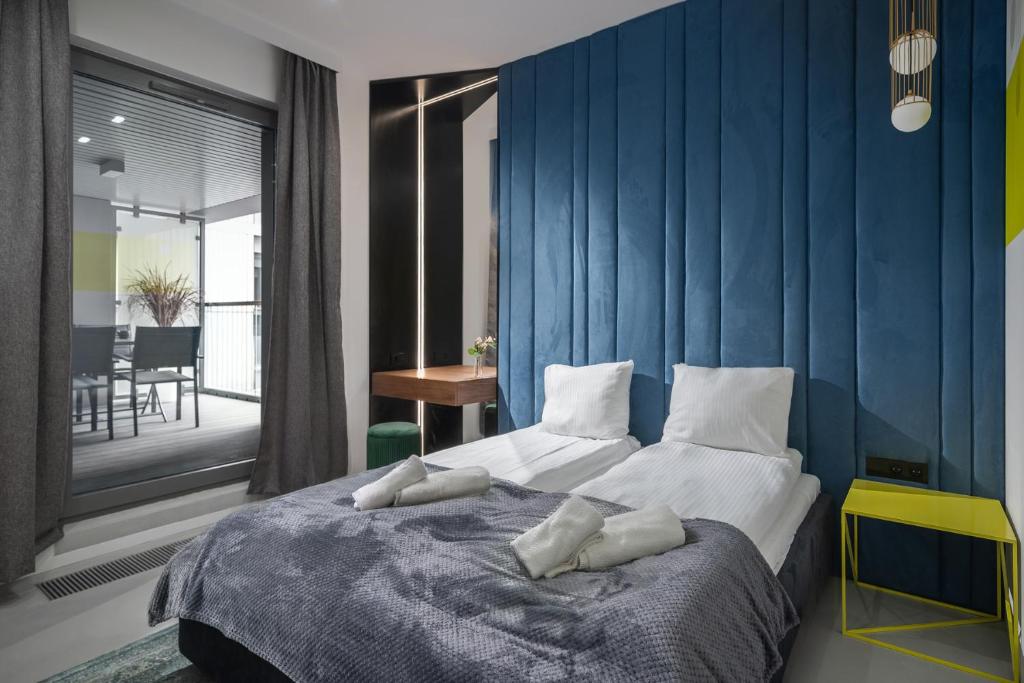 Posteľ alebo postele v izbe v ubytovaní Granaria Comfort Apartments
