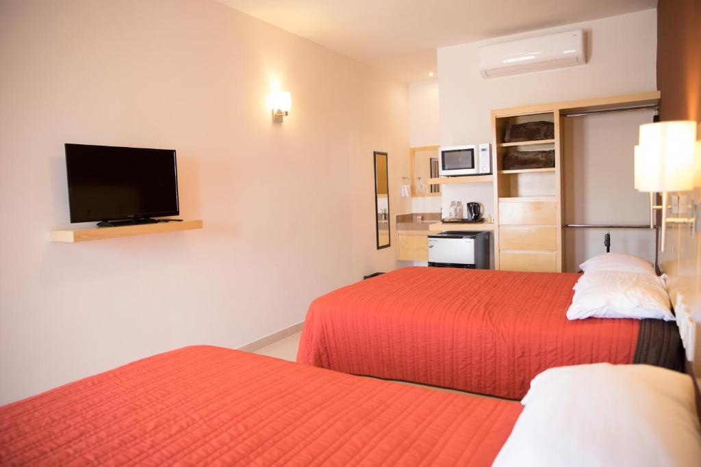 Postel nebo postele na pokoji v ubytování Nova Hotel
