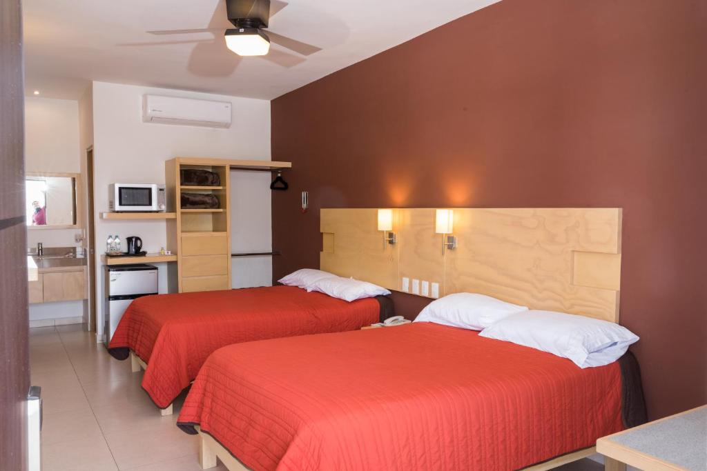Postel nebo postele na pokoji v ubytování Nova Hotel
