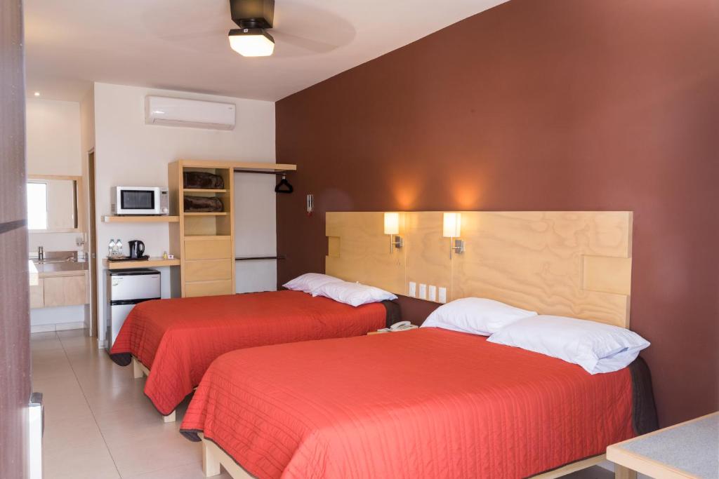 Postel nebo postele na pokoji v ubytování Nova Hotel