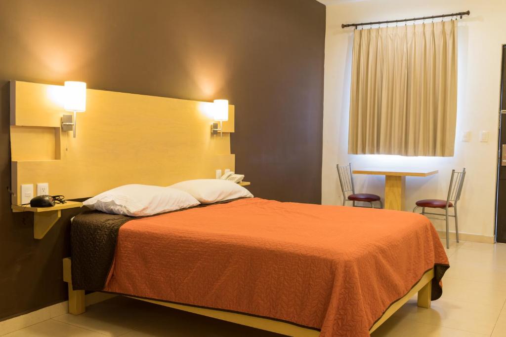 Postel nebo postele na pokoji v ubytování Nova Hotel