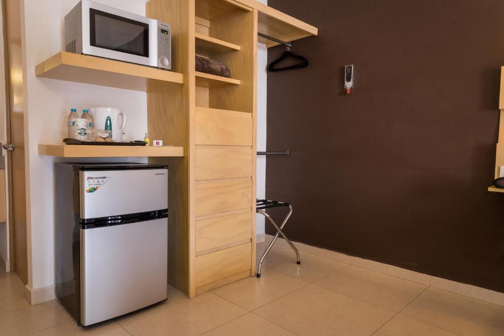Kuchyň nebo kuchyňský kout v ubytování Nova Hotel