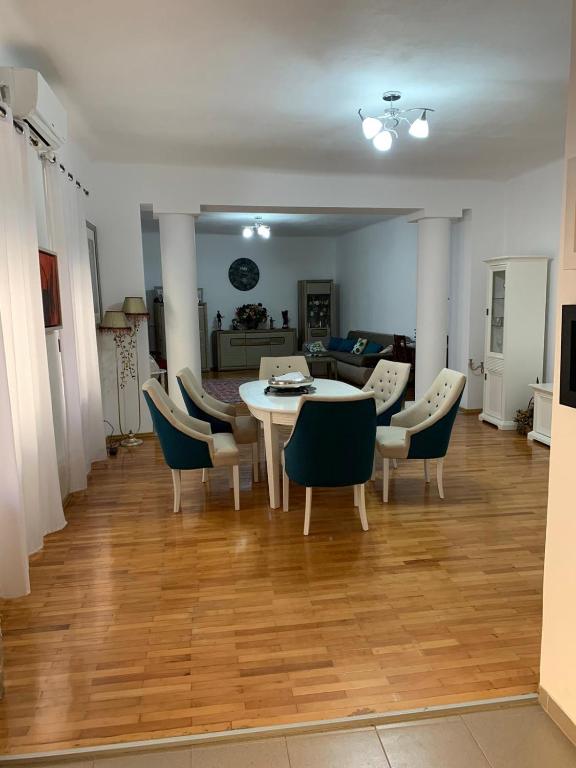 a dining room with a table and chairs at Casa Centru in Mediaş