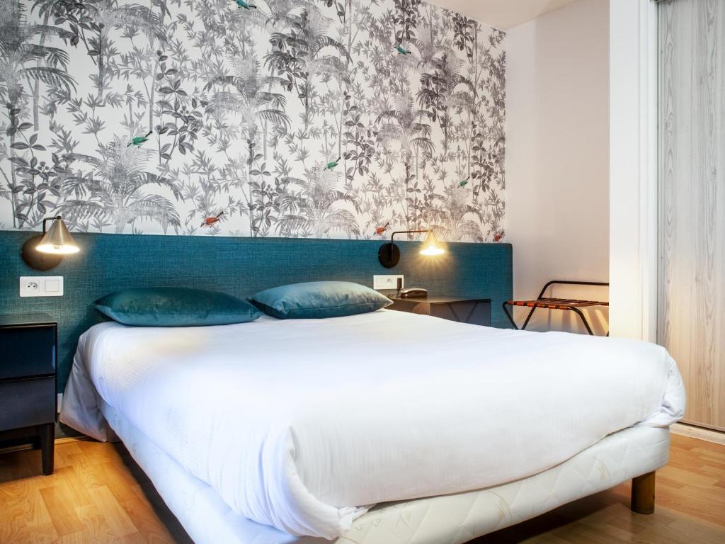 Postel nebo postele na pokoji v ubytování Grand Hôtel du Parc
