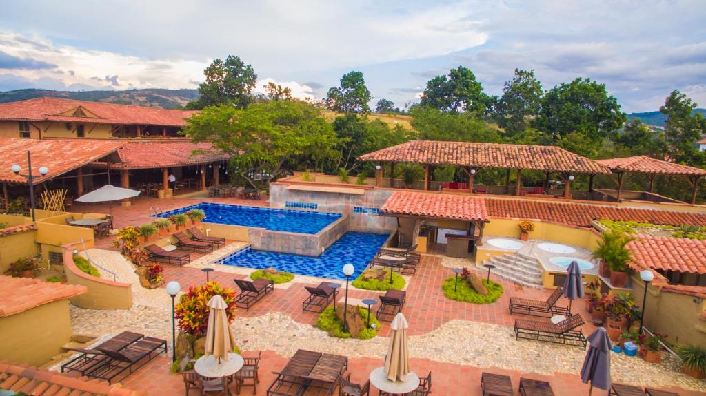 an aerial view of a resort with a swimming pool at Hotel Terra Barichara in Barichara