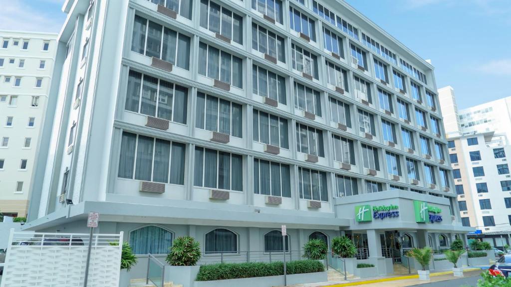 a large white building on a city street at Holiday Inn Express San Juan Condado, an IHG Hotel in San Juan