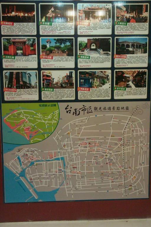a sign with a map on a wall at The Prince Hotel in Tainan