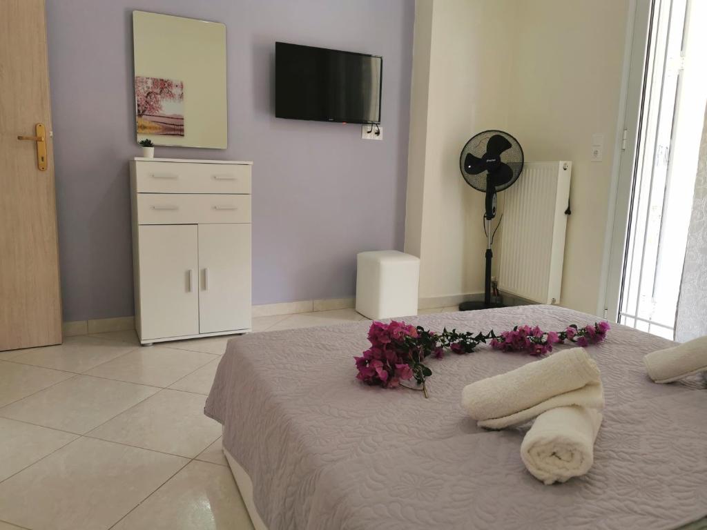 Posteľ alebo postele v izbe v ubytovaní Lefkada SunCentral Apartments