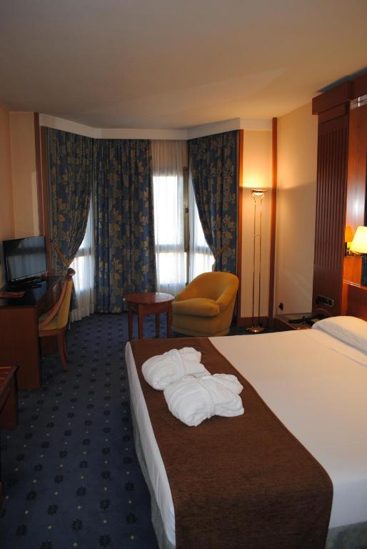 Postel nebo postele na pokoji v ubytování Hotel los Bracos