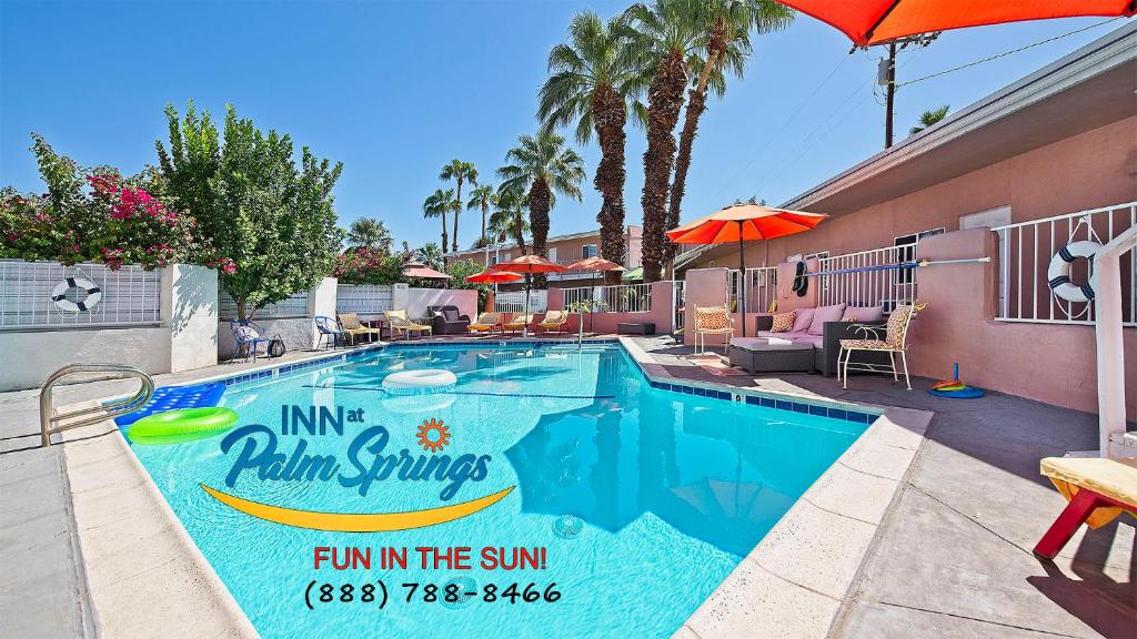 a swimming pool at a palm springs inn in the sun at Inn at Palm Springs in Palm Springs