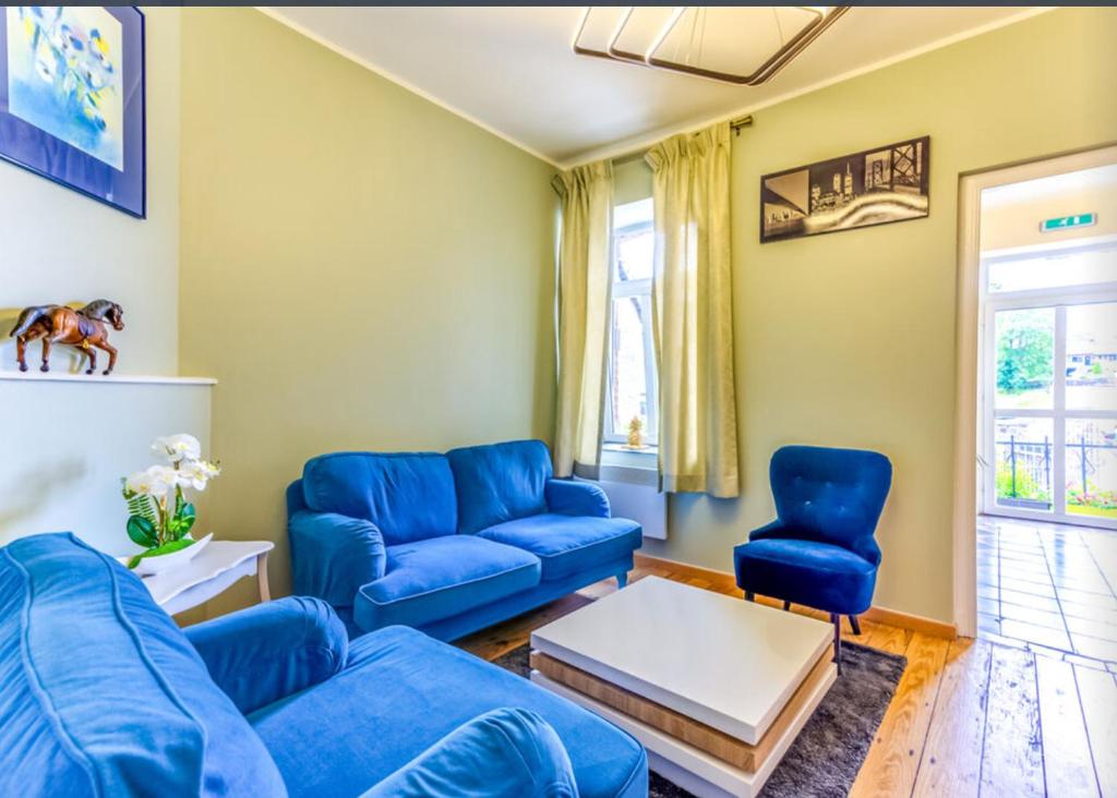 Posezení v ubytování Petit Château de Harzé