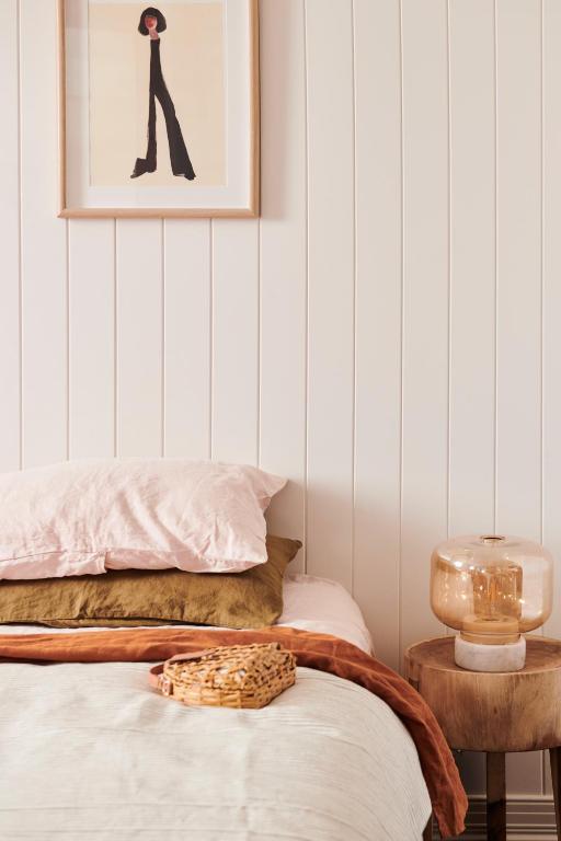 a bedroom with a bed and a picture on the wall at Anchor Geelong in Geelong
