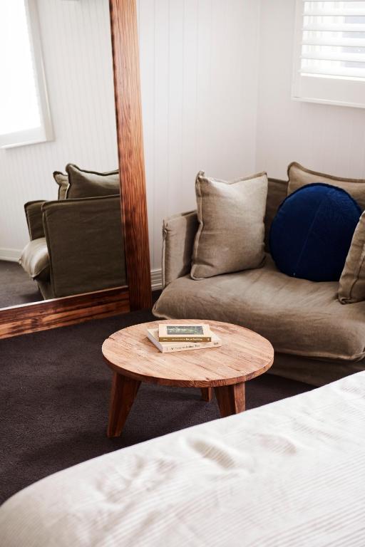 a living room with a couch and a coffee table at Anchor Geelong in Geelong