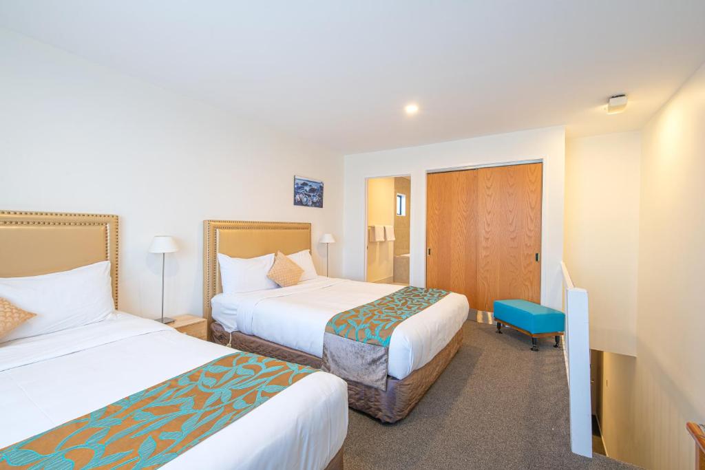 Postel nebo postele na pokoji v ubytování Auckland Newmarket Motel
