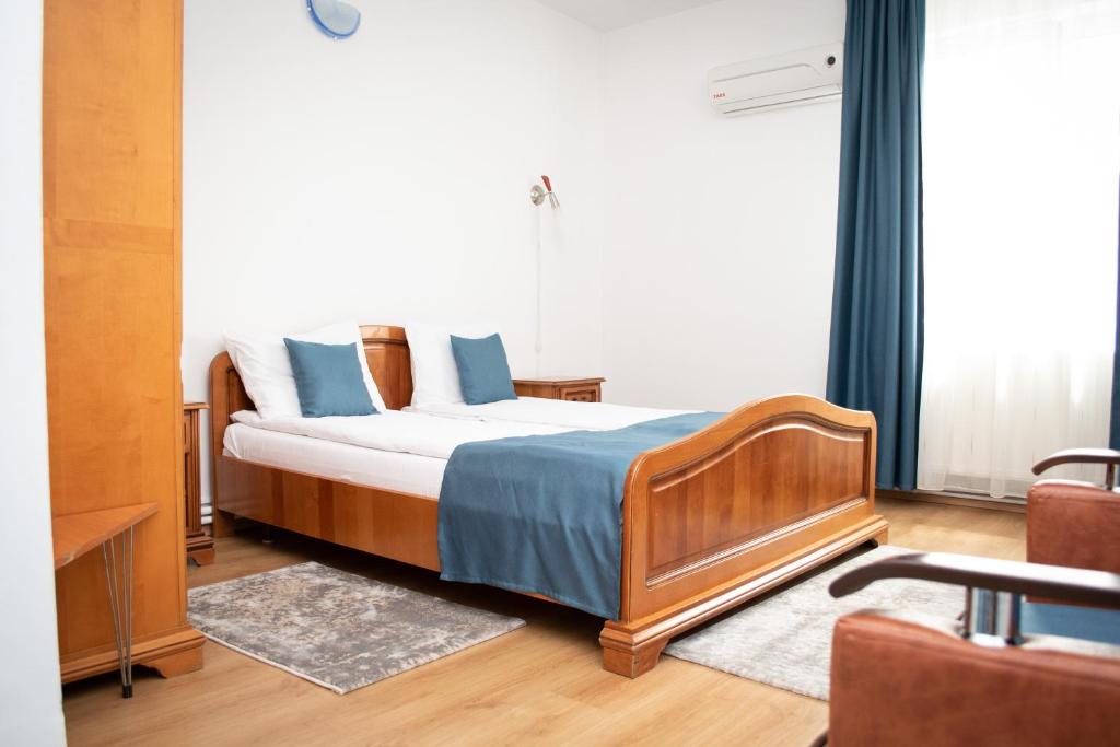 Postel nebo postele na pokoji v ubytování Motel Via Targu Mures