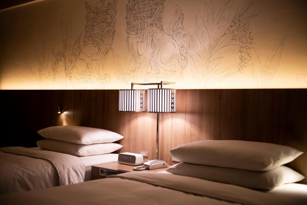 Postel nebo postele na pokoji v ubytování Renaissance Okinawa Resort