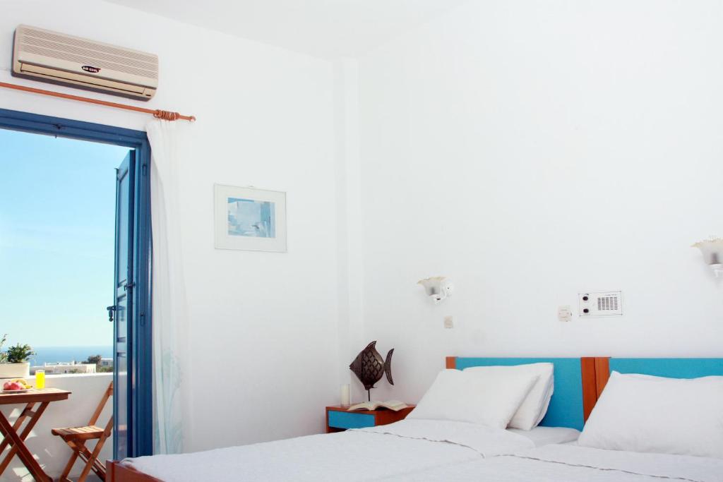 Postel nebo postele na pokoji v ubytování Hotel Kalma