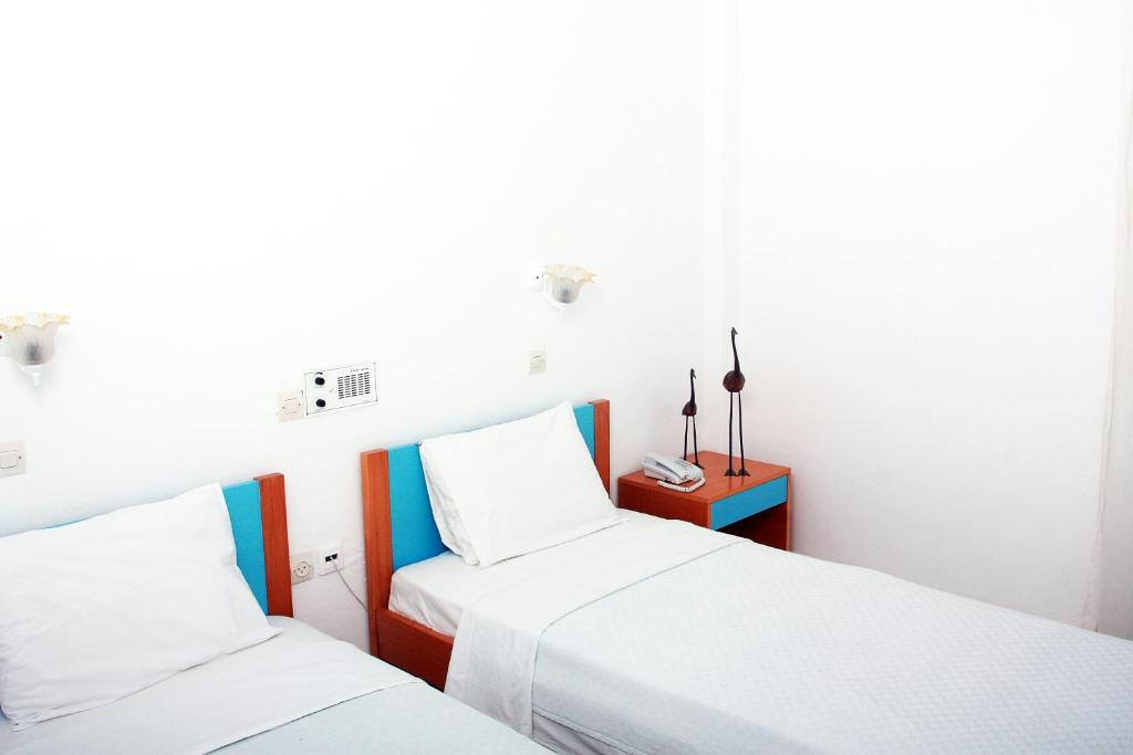 Postel nebo postele na pokoji v ubytování Hotel Kalma