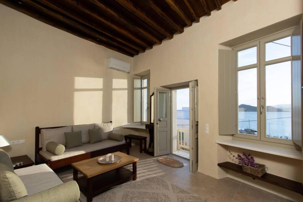 a living room with a couch and a table at Petrino Naxos in Naxos Chora