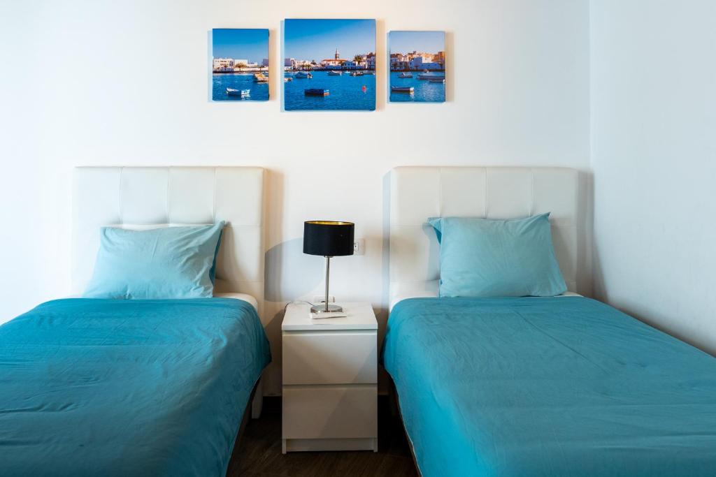 Postel nebo postele na pokoji v ubytování Casa a primera linea de mar