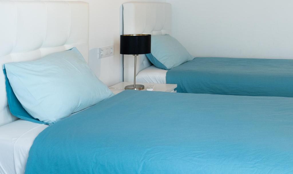 Postel nebo postele na pokoji v ubytování Casa a primera linea de mar