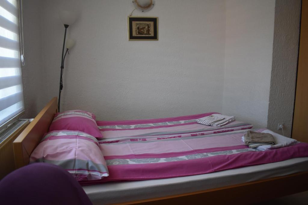 Postel nebo postele na pokoji v ubytování Dobrila Apartments