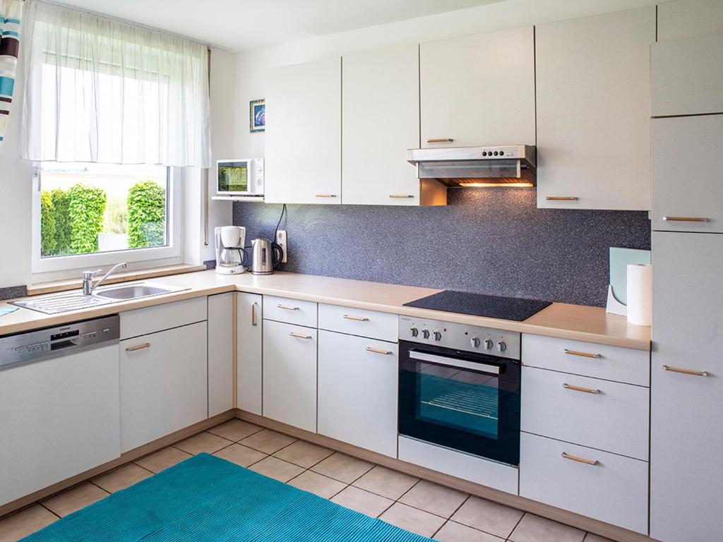 Kuchyňa alebo kuchynka v ubytovaní Traumferienhaus XXL Ortner
