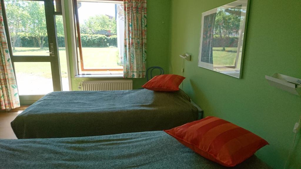 Postel nebo postele na pokoji v ubytování Frederiksværk Camping & Hostel