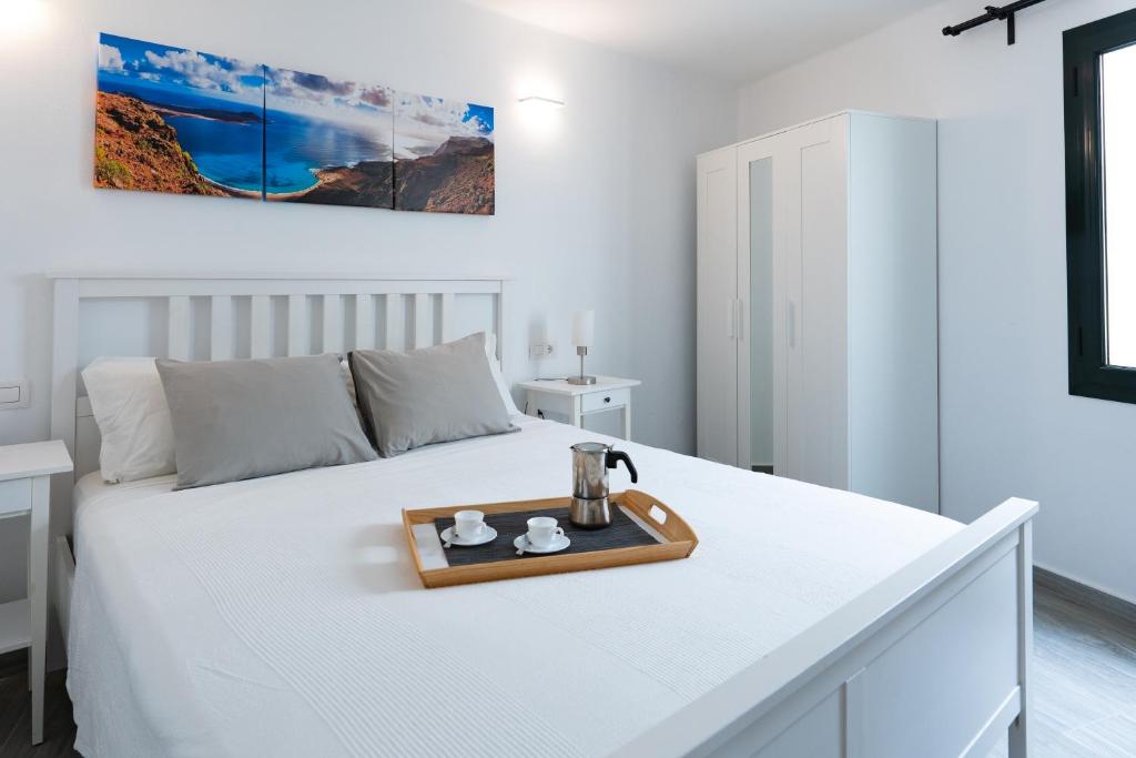Postel nebo postele na pokoji v ubytování Casa a primera linea de mar
