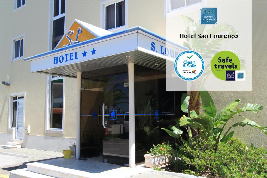 a hotel sign on the front of a building at Hotel São Lourenço in Samora Correia