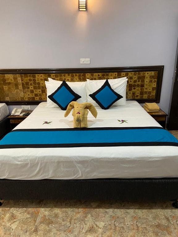 Postel nebo postele na pokoji v ubytování Blue Sand Beach Resort