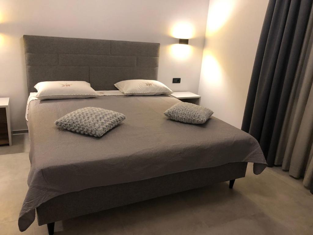 Posteľ alebo postele v izbe v ubytovaní Apartments & Room Piutti