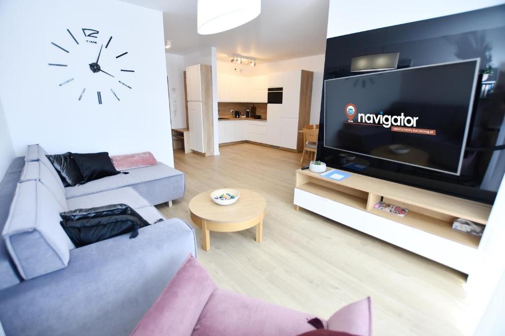 Televízia a/alebo spoločenská miestnosť v ubytovaní Apartamenty NAVIGATOR PORT-NADMORSKIE TARASY Brilliant 613