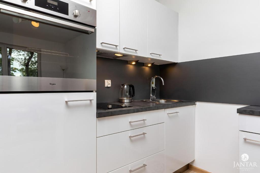 Kuchyň nebo kuchyňský kout v ubytování Jantar Apartamenty - Family Vacation Polanki