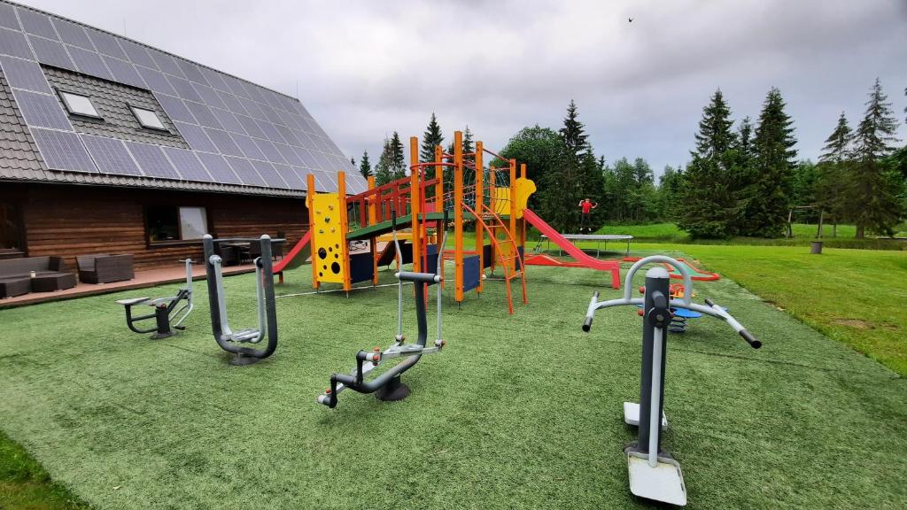 a group of playground equipment in a yard at Raamatu puhkemaja in Jäärja