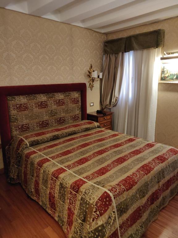 Cama ou camas em um quarto em Ca' Marinella