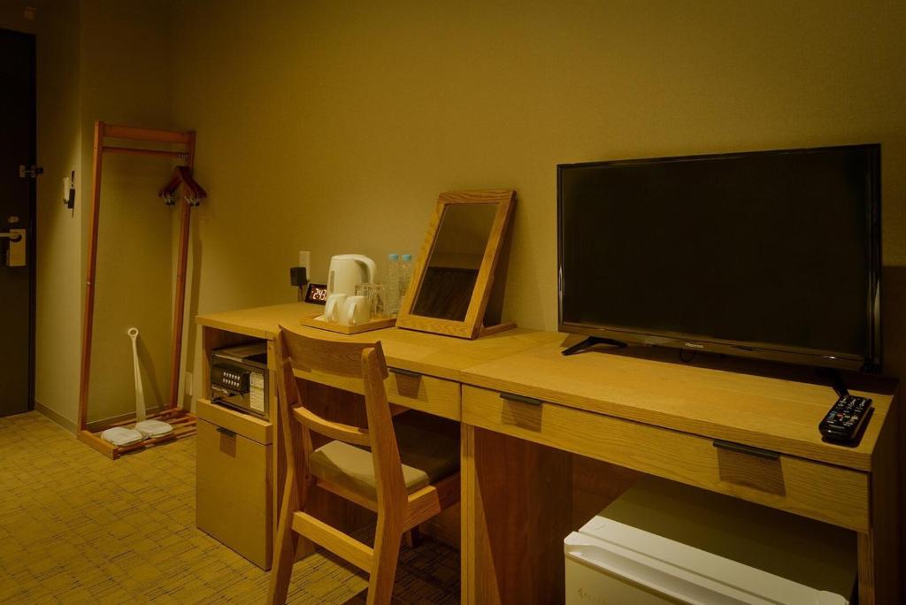 TV a/nebo společenská místnost v ubytování ikoi HOTEL