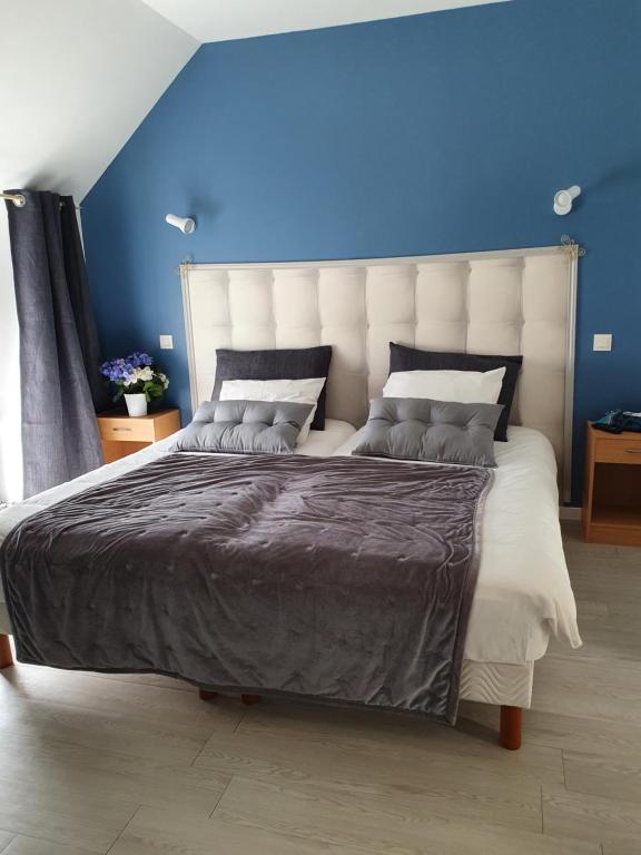 Postel nebo postele na pokoji v ubytování Hôtel - Restaurant l'Hortensia