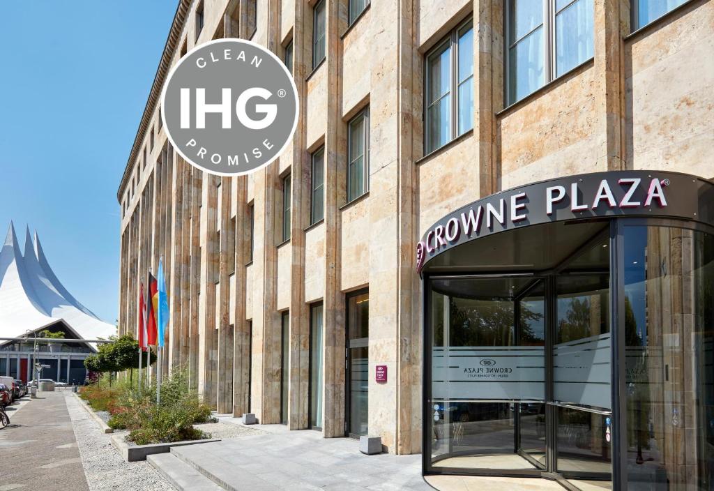 a building with a sign on the front of it at Crowne Plaza Berlin - Potsdamer Platz, an IHG Hotel in Berlin