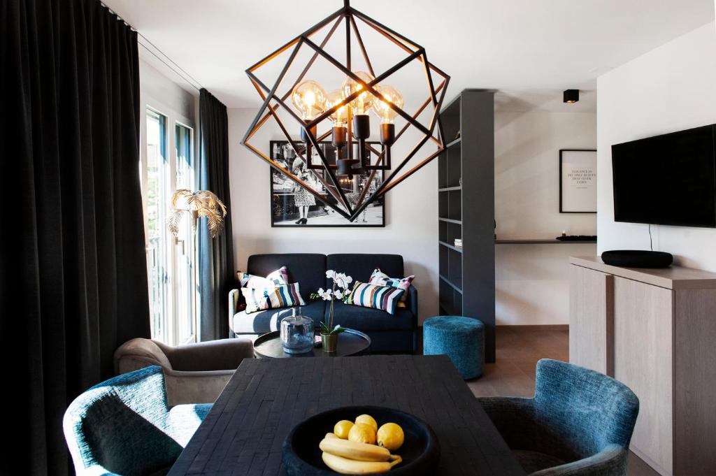 TV a/nebo společenská místnost v ubytování COSMOPOLITAN APARTMENTS Zürich Seefeld
