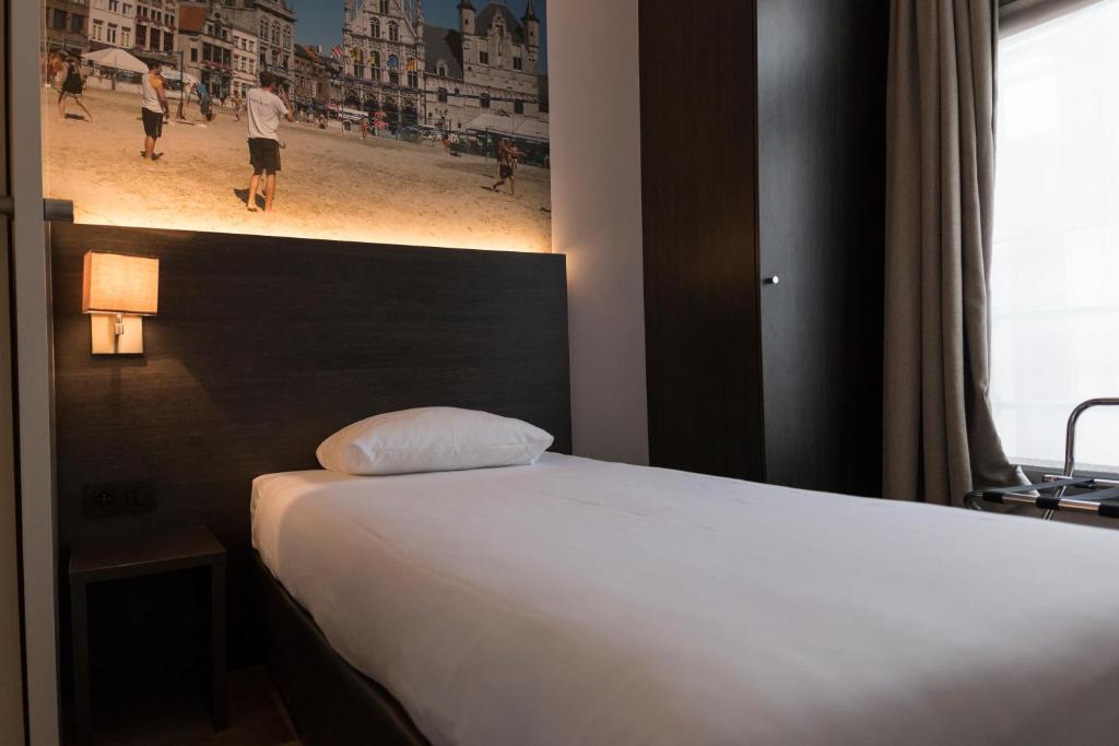 Postel nebo postele na pokoji v ubytování 3 Paardekens - City Centre Hotel