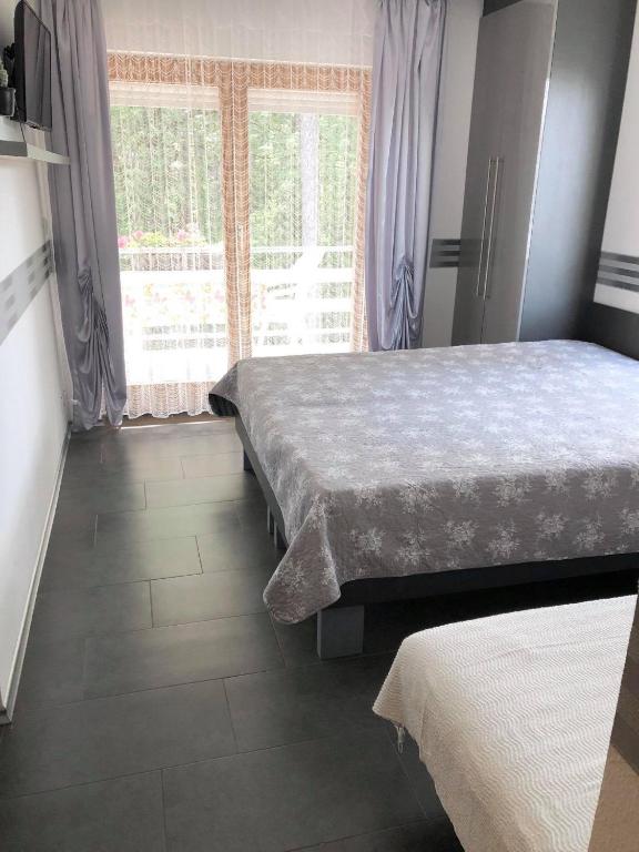 Postel nebo postele na pokoji v ubytování Pearl Home Siofok