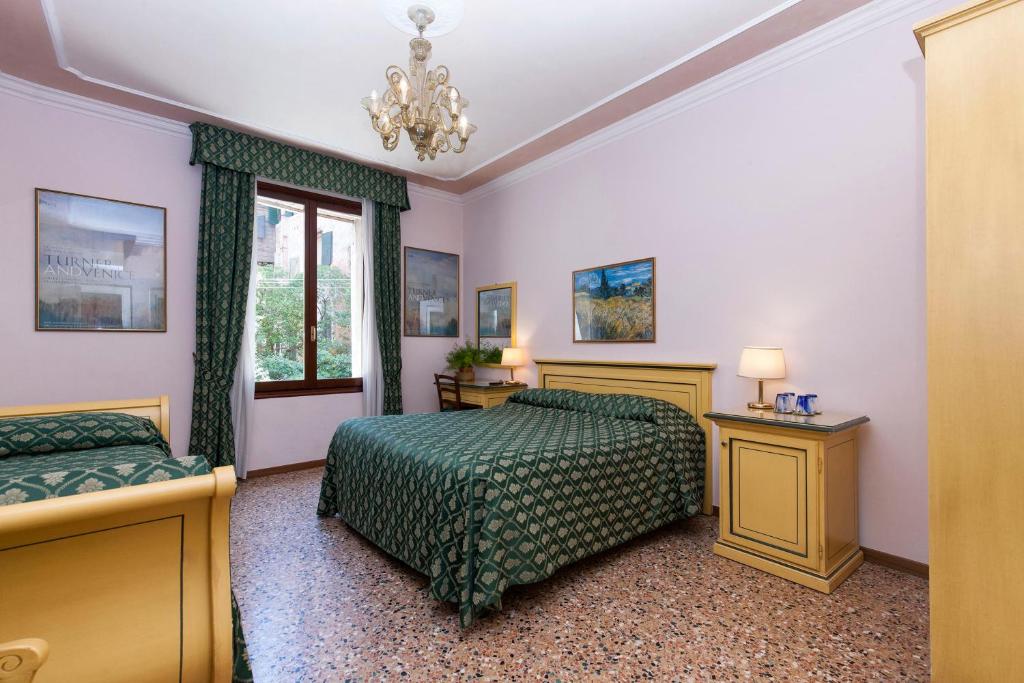Postel nebo postele na pokoji v ubytování Zaguri B&B